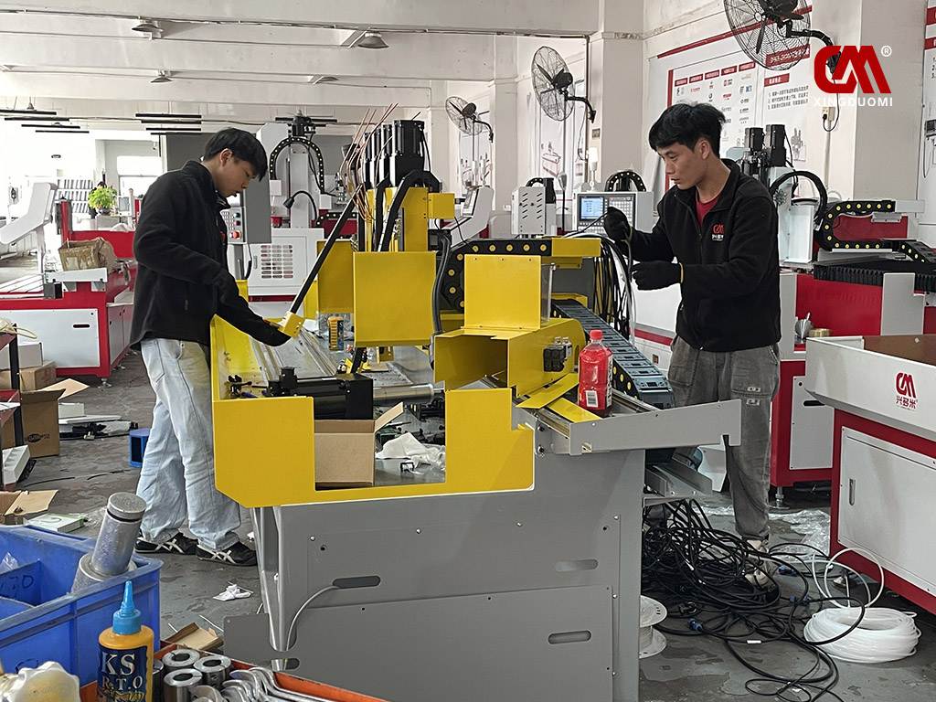 DUOMI CNC engineers are assembling components of the four-spindle thermal drilling and tapping machine.jpg